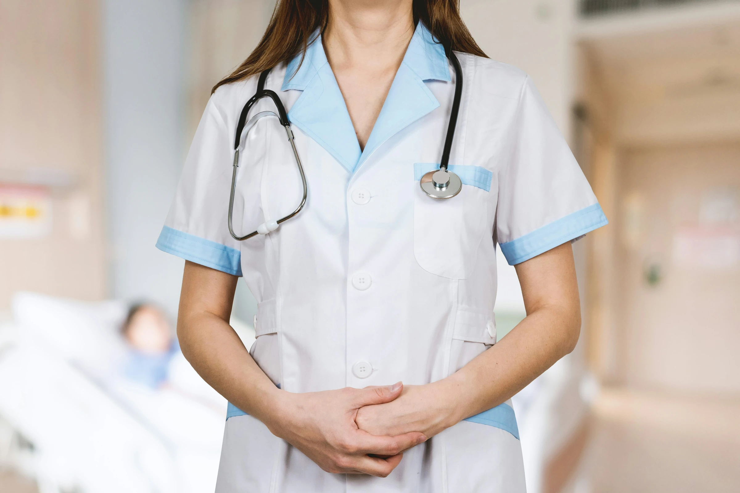A healthcare professional wearing a stethoscope in a clinic