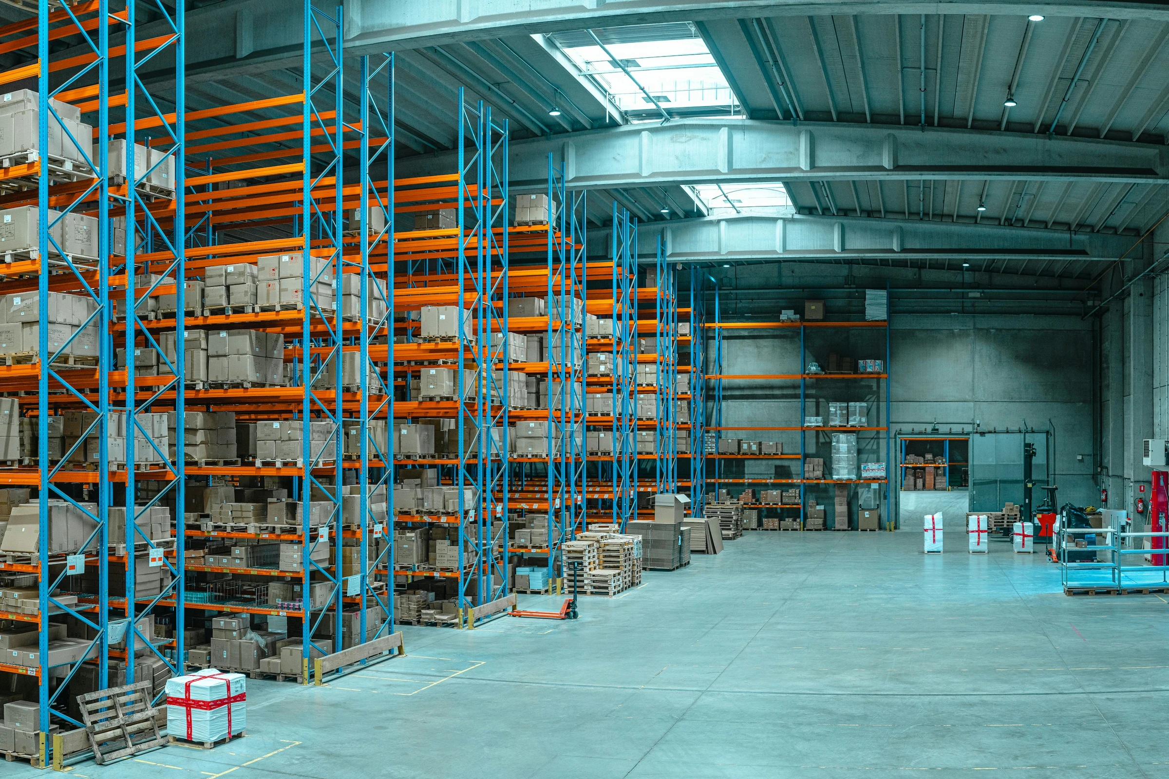 Warehouse aisles with pallet racking and boxed inventory