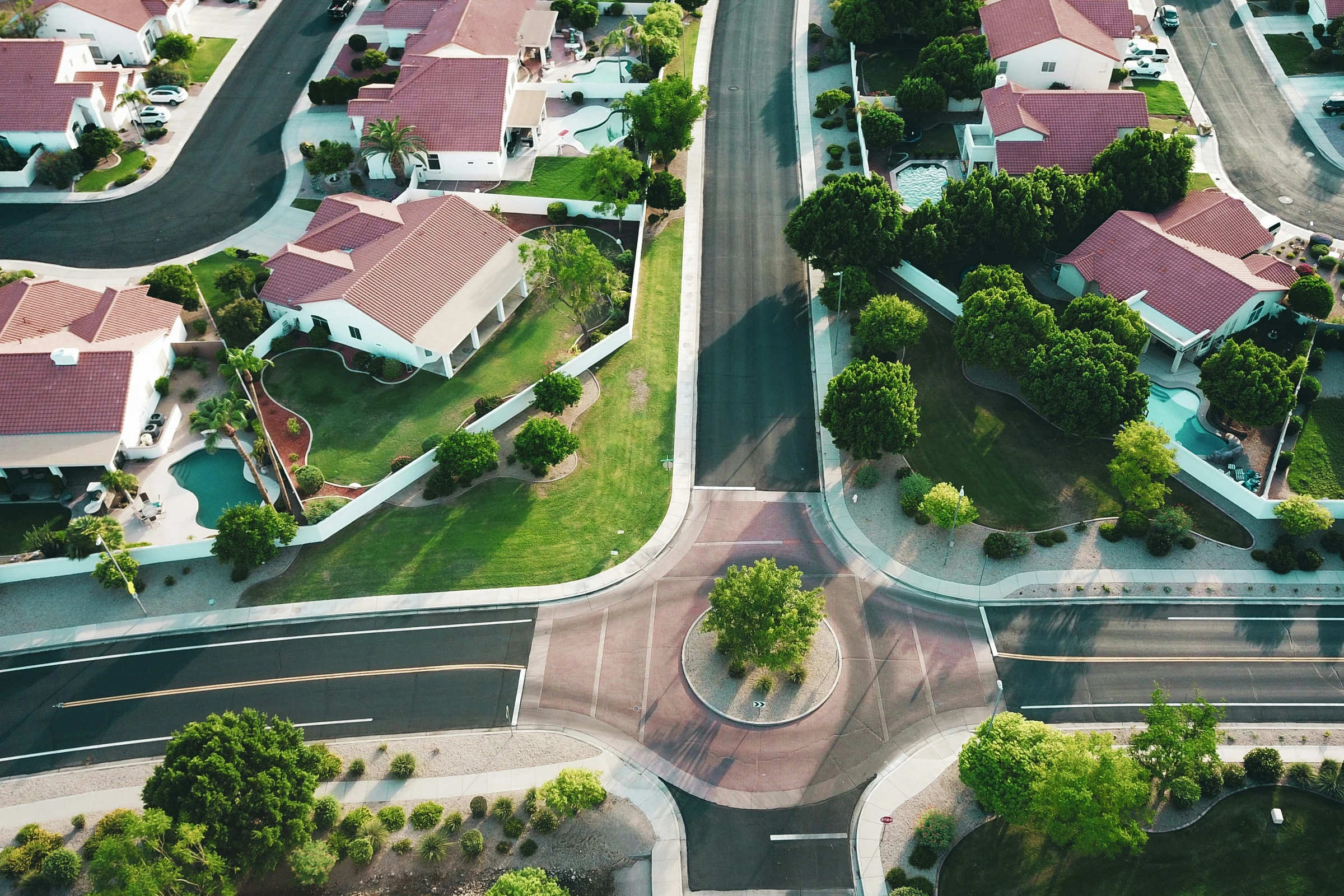An aerial view of homes and streets in a residential neighbourhood